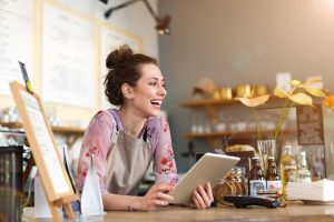 oung woman using digital tablet in coffee shop