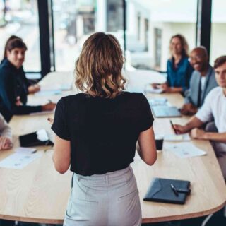Businesswoman addressing a meeting in office
