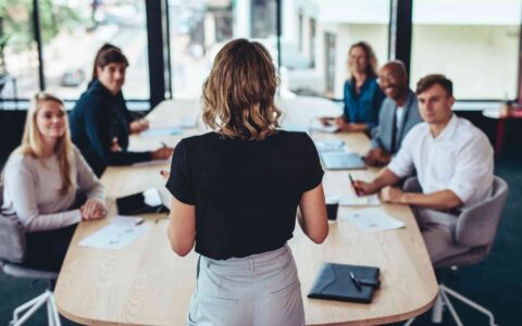 Businesswoman addressing a meeting in office